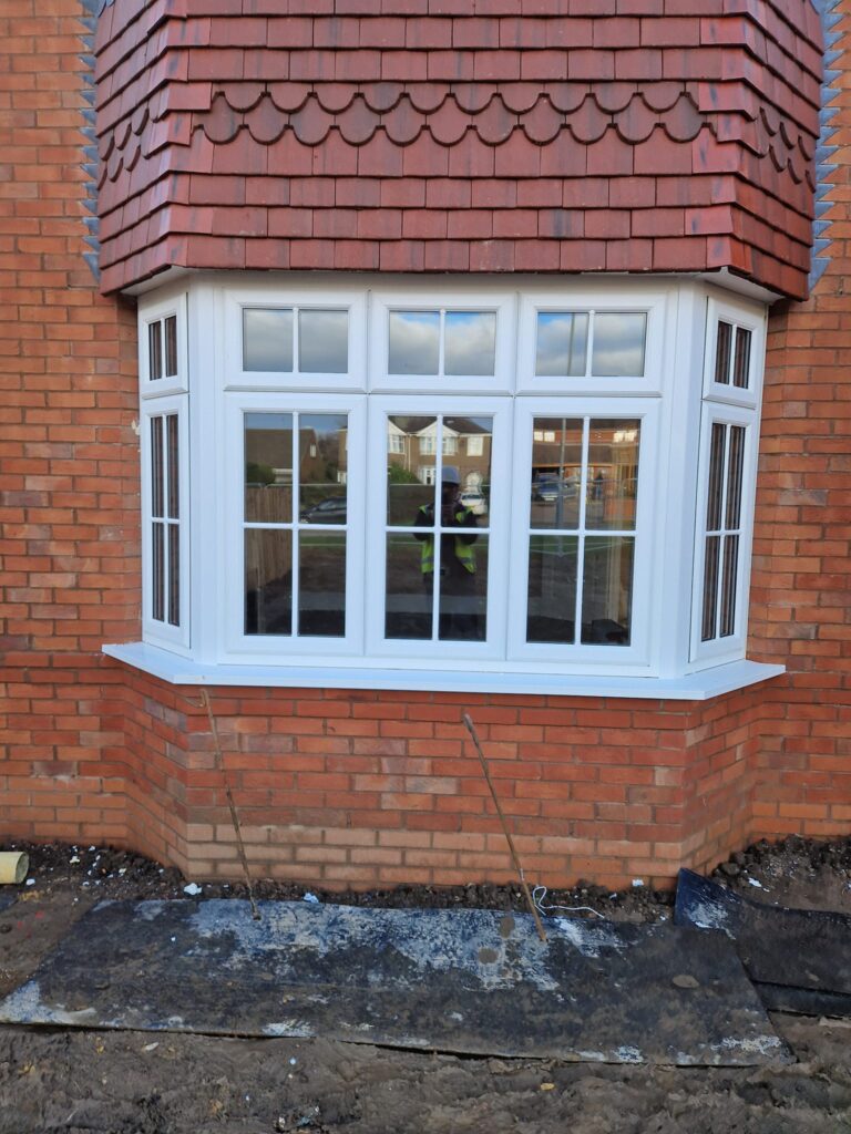 New white UPVC bay window replacement with Georgian bars in Cannock